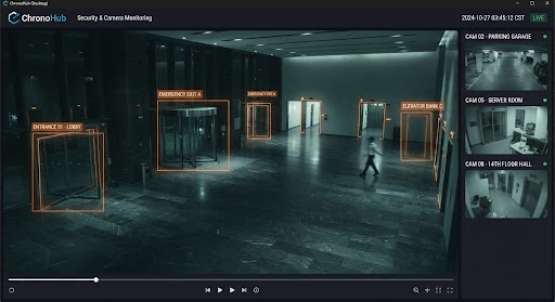 A wide-angle security camera shot of a corporate office lobby at night.